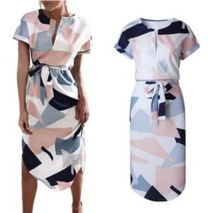 NWOT. Never worn. Geometric V Neck Dress
